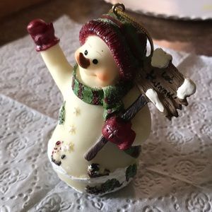 Snowman with let it snow sign waving